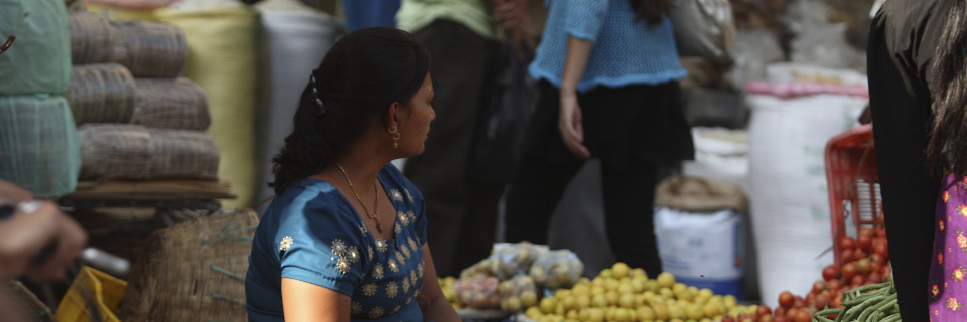 A vegetable seller, at Indra Chowk, Kathmandu. Tourism, accounted for 3.8 percent of the GDP in 1995-96, although numbers have fluctuated depending on the political situation in the country. The city's rich history is nearly 2000 years old, with Hinduism being the dominant religion followed by Buddhism. It is known as the land of the ethnic Newar community. (Newar means citizen of Nepal). Kathmandu, Nepal. 2010. (Photo by: Mahmud /Majority World/UIG via Getty Images)