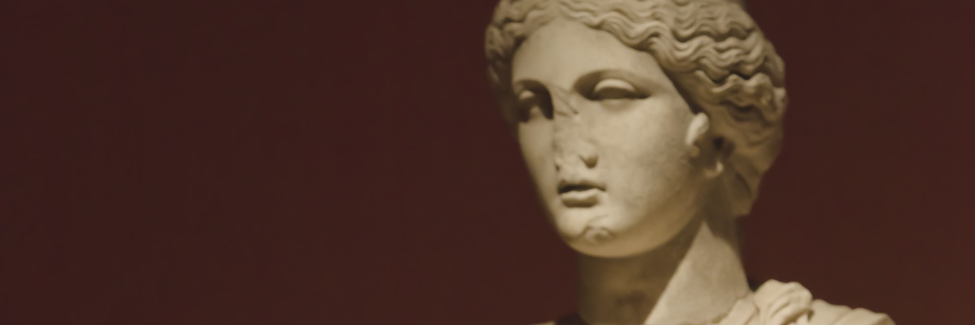 Woman photographing statue of Tyche (Fortuna).