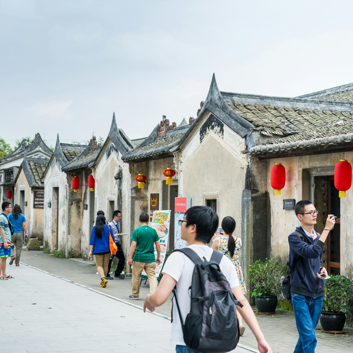 Shenzhen, China, April, 3rd, 2016, Editorial: Tourists visiting Guanlan Engraved Printing Painting Village, Shenzhen, China; Shutterstock ID 541482490; Your name (First / Last): Megan Eaves; GL account no.: 65050; Netsuite department name: Online Editorial; Full Product or Project name including edition: Destination image - North Asia