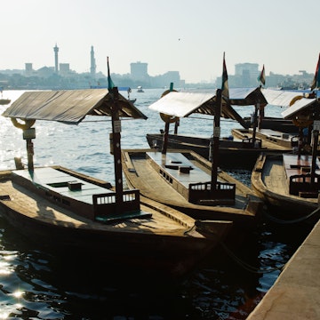 Traditional Abra ferries at the creek in Dubai, United Arab Emirates; Shutterstock ID 119893231; Your name (First / Last): Lauren Keith; GL account no.: 65050; Netsuite department name: Online Editorial; Full Product or Project name including edition: Dubai Neighbourhoods Update