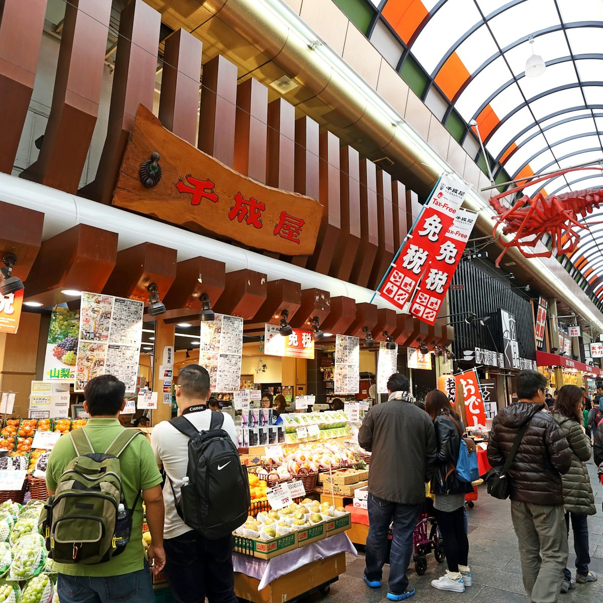 OSAKA, JAPAN - NOV 6: Tourists shopping and visit  in Kuromon Ichiba market on November 6, 2015 in Osaka, Japan. it is market places popular of Osaka; Shutterstock ID 413962024; Your name (First / Last): Laura Crawford; GL account no.: 65050; Netsuite department name: Online Editorial; Full Product or Project name including edition: Osaka city app POI images
