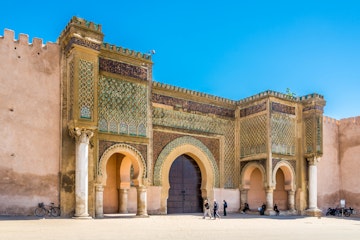 MEKNES,MOROCCO - APRIL 7,2017 - Gate Bab El-Mansour at the El Hedim square in Meknes. Meknes is one of the four Imperial cities of Morocco.; Shutterstock ID 646182178; Your name (First / Last): Lauren Keith; GL account no.: 65050; Netsuite department name: Online Editorial; Full Product or Project name including edition: Day in Meknes article