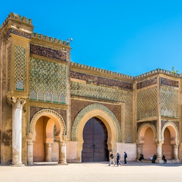 MEKNES,MOROCCO - APRIL 7,2017 - Gate Bab El-Mansour at the El Hedim square in Meknes. Meknes is one of the four Imperial cities of Morocco.; Shutterstock ID 646182178; Your name (First / Last): Lauren Keith; GL account no.: 65050; Netsuite department name: Online Editorial; Full Product or Project name including edition: Day in Meknes article