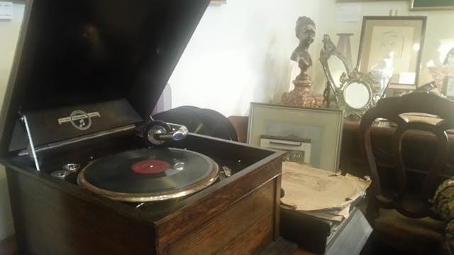 An old record player in working order, ready to be played at Salon Antykow Pasja