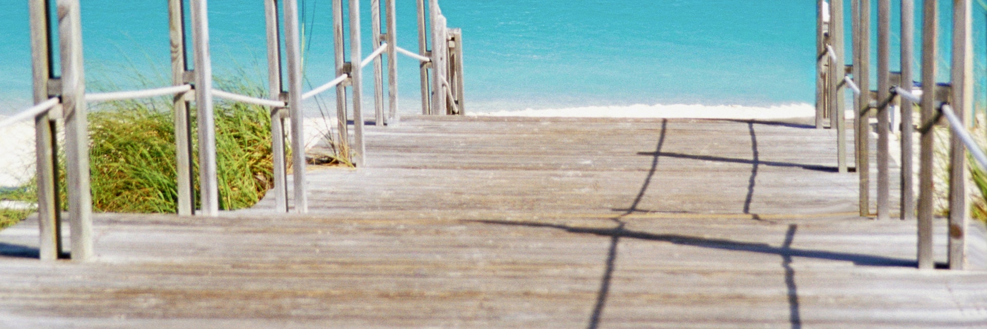 Caribbean, Turks and Caicos Islands, Providenciales, Grace Bay Beach, Boardwalk over a sea
