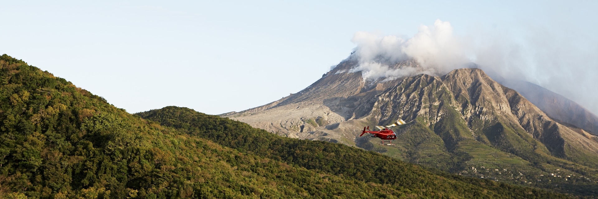 Helicopter flying near Soufriere Hills volcano.