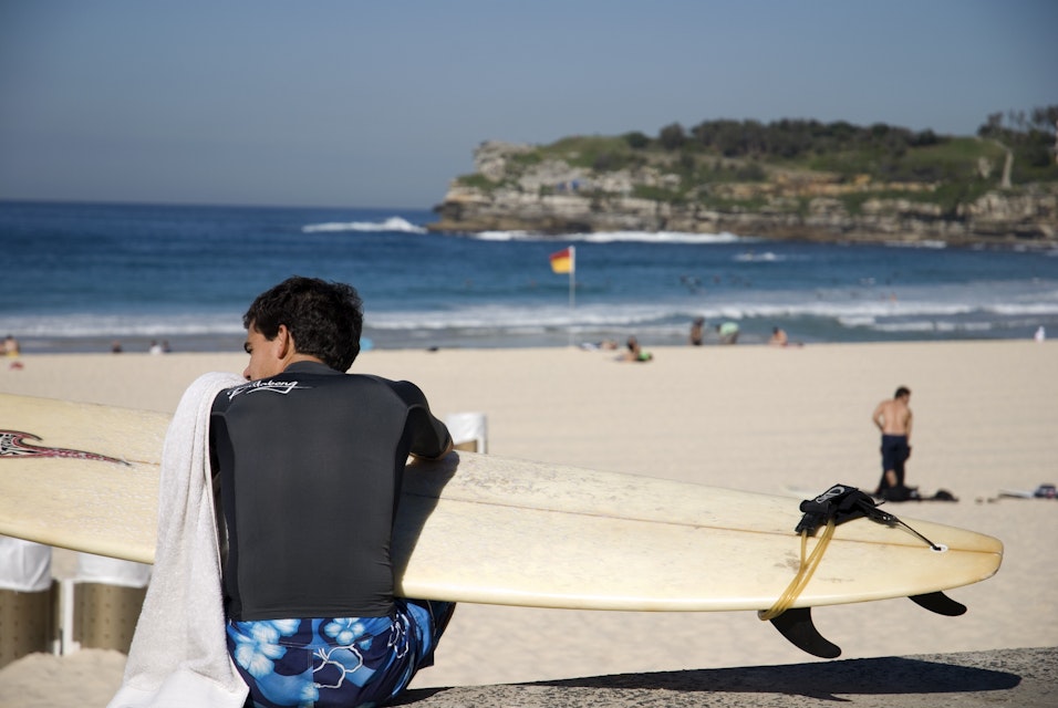 Surfer waiting at Bondi Beach.