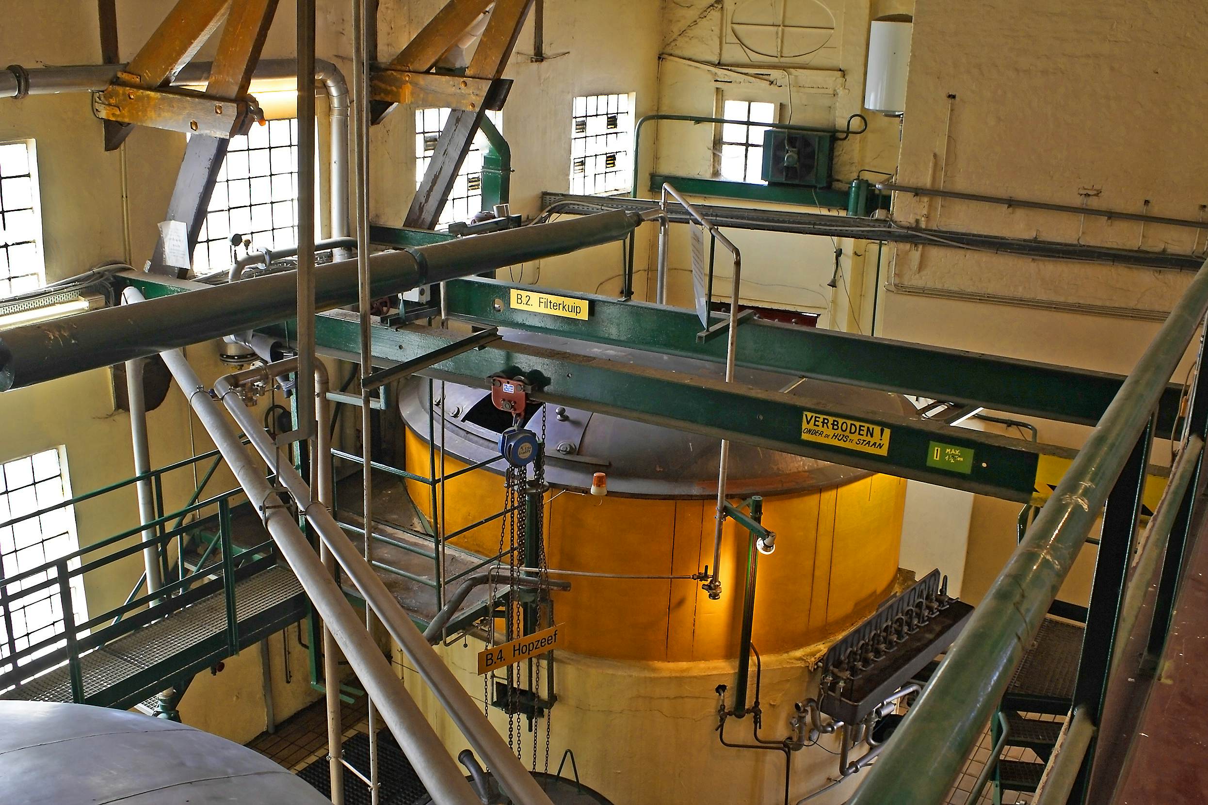 ANTWERP, BELGIUM - MAY 10, 2006: Machinery of city brewery De Koninck, beer brewed here since 1833. The Belgian beer culture is on the list of intangible cultural heritage UNESCO.; Shutterstock ID 564151312; Your name (First / Last): Daniel Fahey; GL account no.: 65050; Netsuite department name: Online Editorial; Full Product or Project name including edition: De Koninck POI
