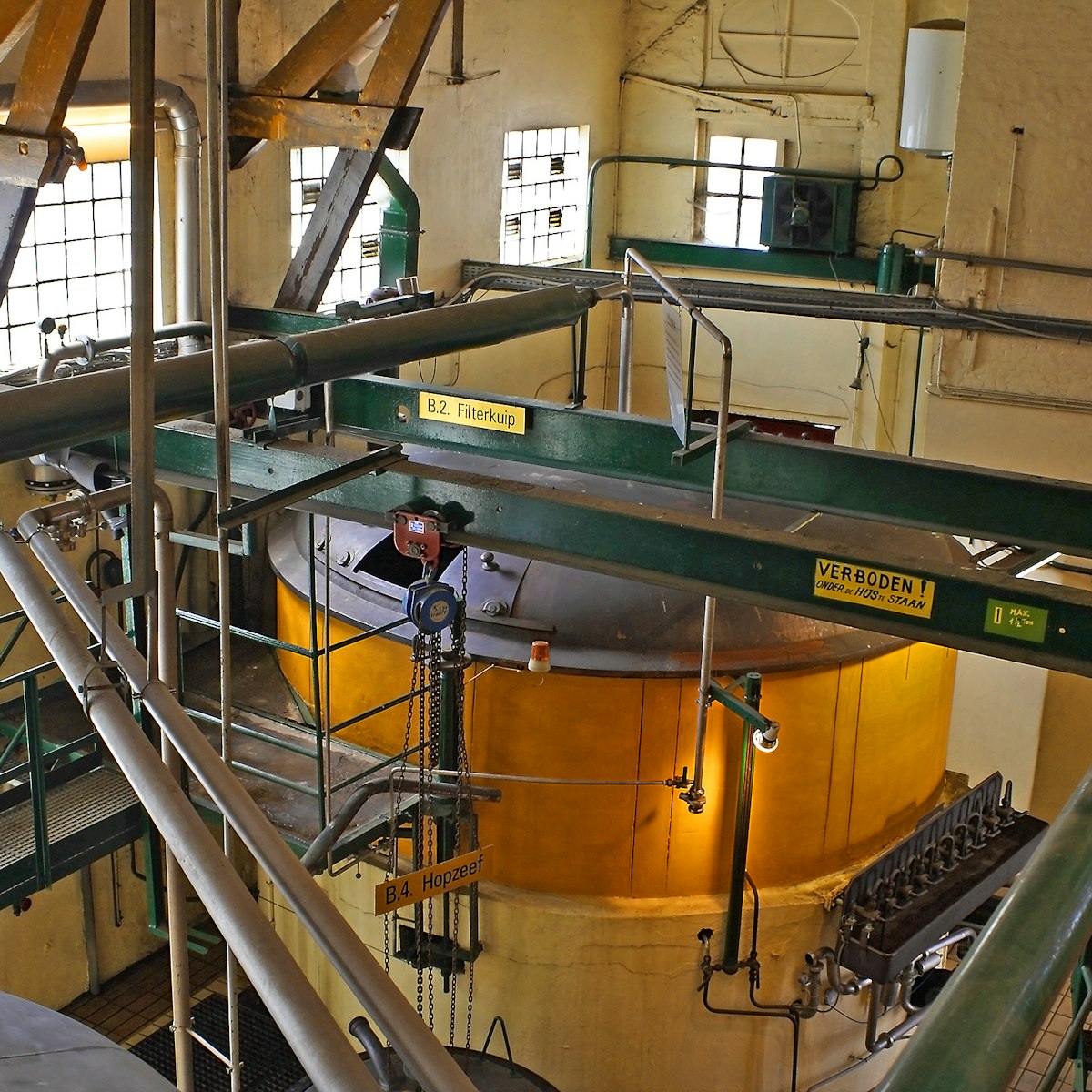 ANTWERP, BELGIUM - MAY 10, 2006: Machinery of city brewery De Koninck, beer brewed here since 1833. The Belgian beer culture is on the list of intangible cultural heritage UNESCO.; Shutterstock ID 564151312; Your name (First / Last): Daniel Fahey; GL account no.: 65050; Netsuite department name: Online Editorial; Full Product or Project name including edition: De Koninck POI