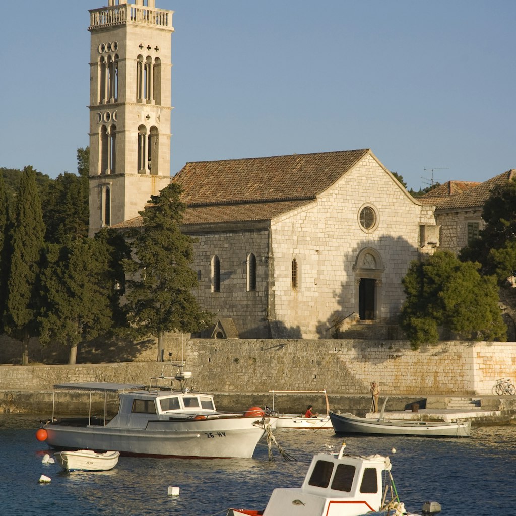 Fishing boats and Franciscan monastery.