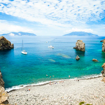 Cala Junco - small bay of Panarea - one of Aeolian Islands near Sicily (Italy). Lipari and Salina islands visible on the horizon.