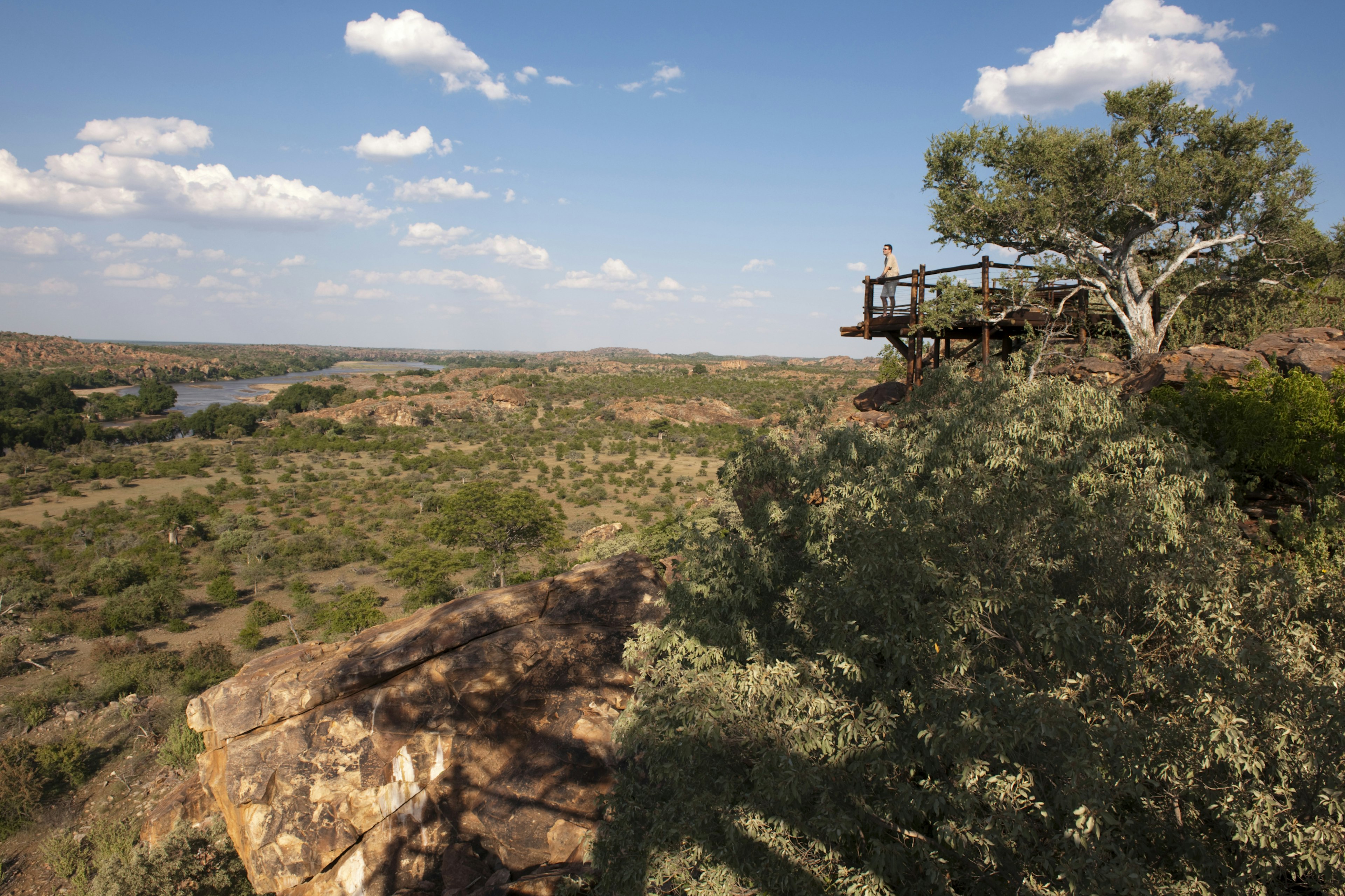 A tourist looks out at the confluence of the Limpopo and Shashe rivers in Mapungubwe National Park