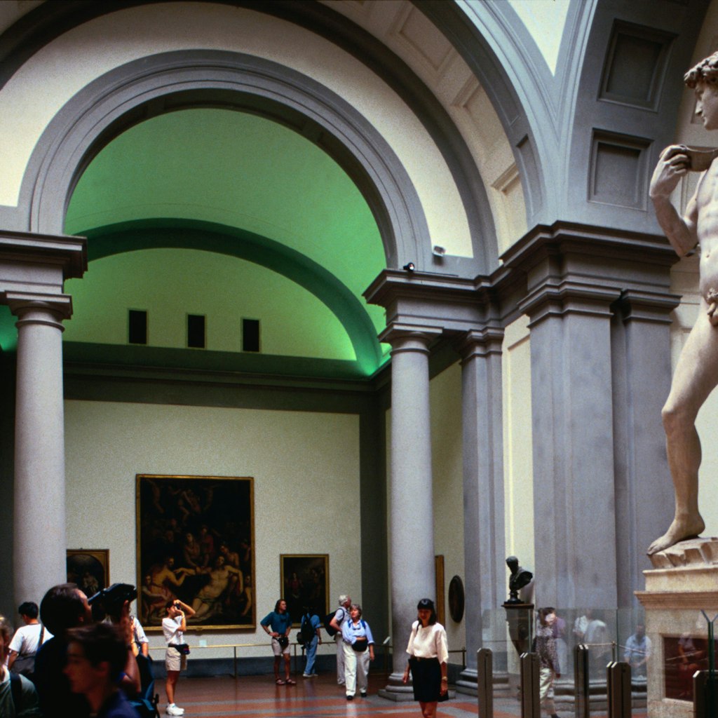 People admiring Michelangelo's statue of David in the Galleria dell'Accademia.