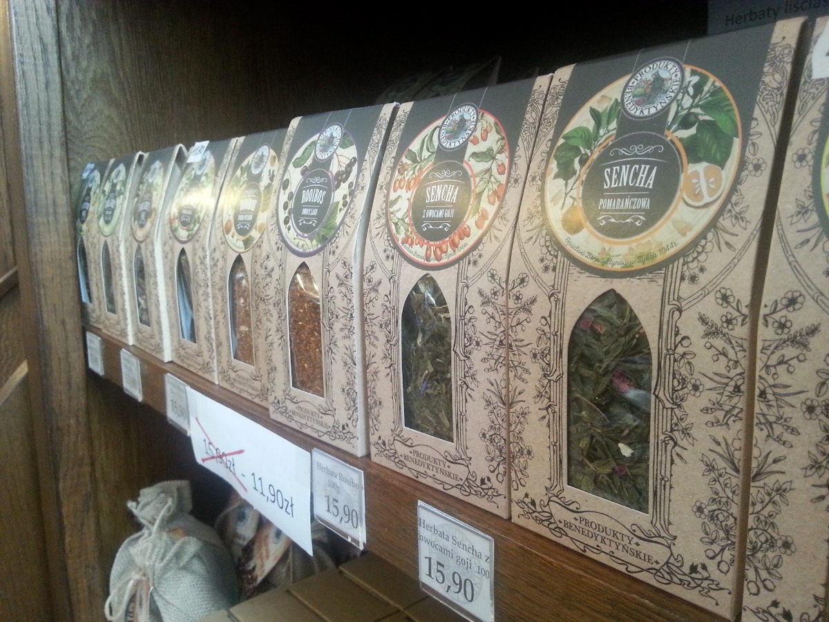 Shelves packed with natural, loose leaf herbal teas at Produkty Benedyktynskie