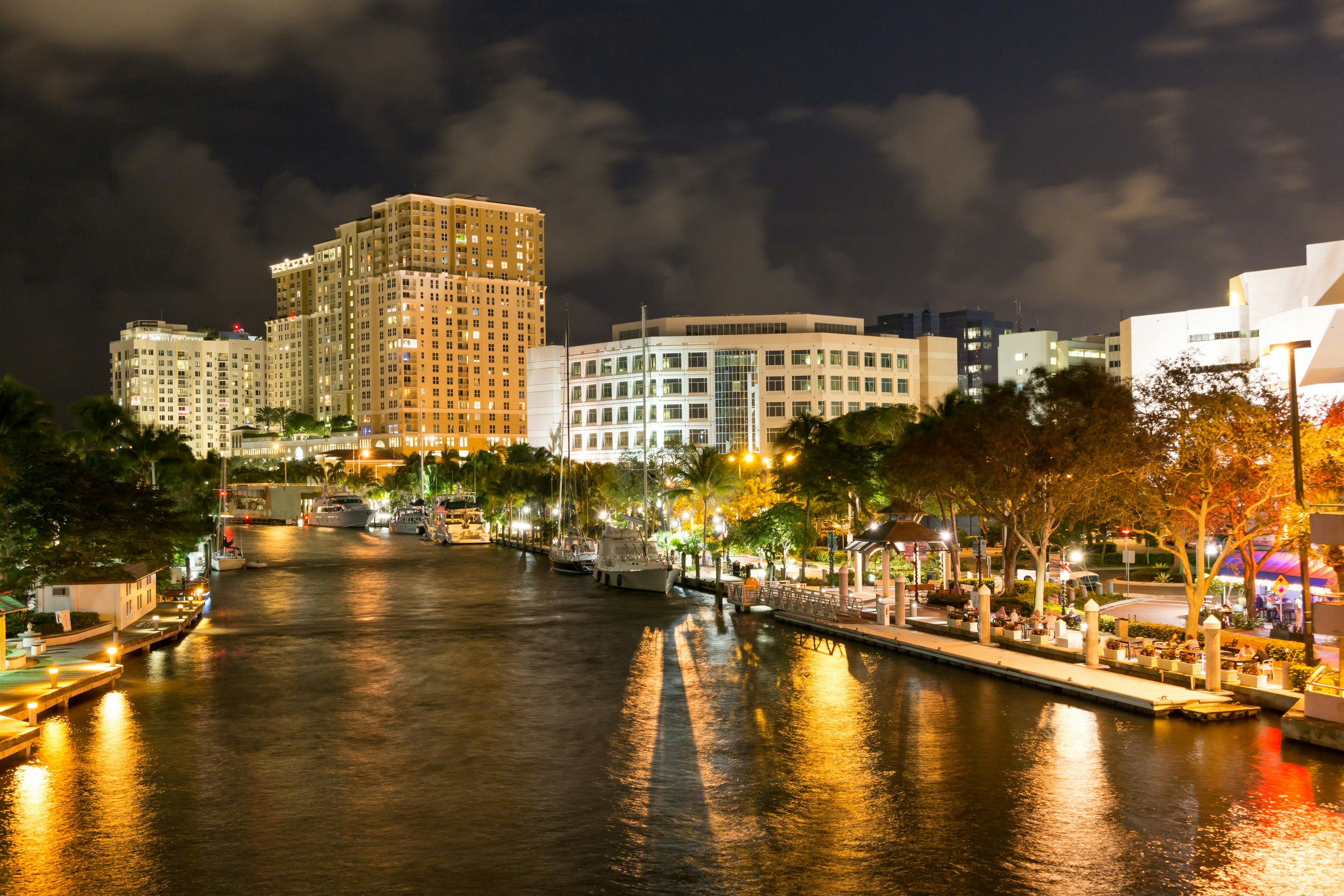 FORT LAUDERDALE, USA - DEC 6, 2015: Night view of New River with Riverwalk promenade highrise condominium buildings and yachts in Fort Lauderdale, Florida; Shutterstock ID 355336061; Your name (First / Last): Lauren Keith; GL account no.: 65050; Netsuite department name: Content Asset; Full Product or Project name including edition: Guides Project Eastern USA