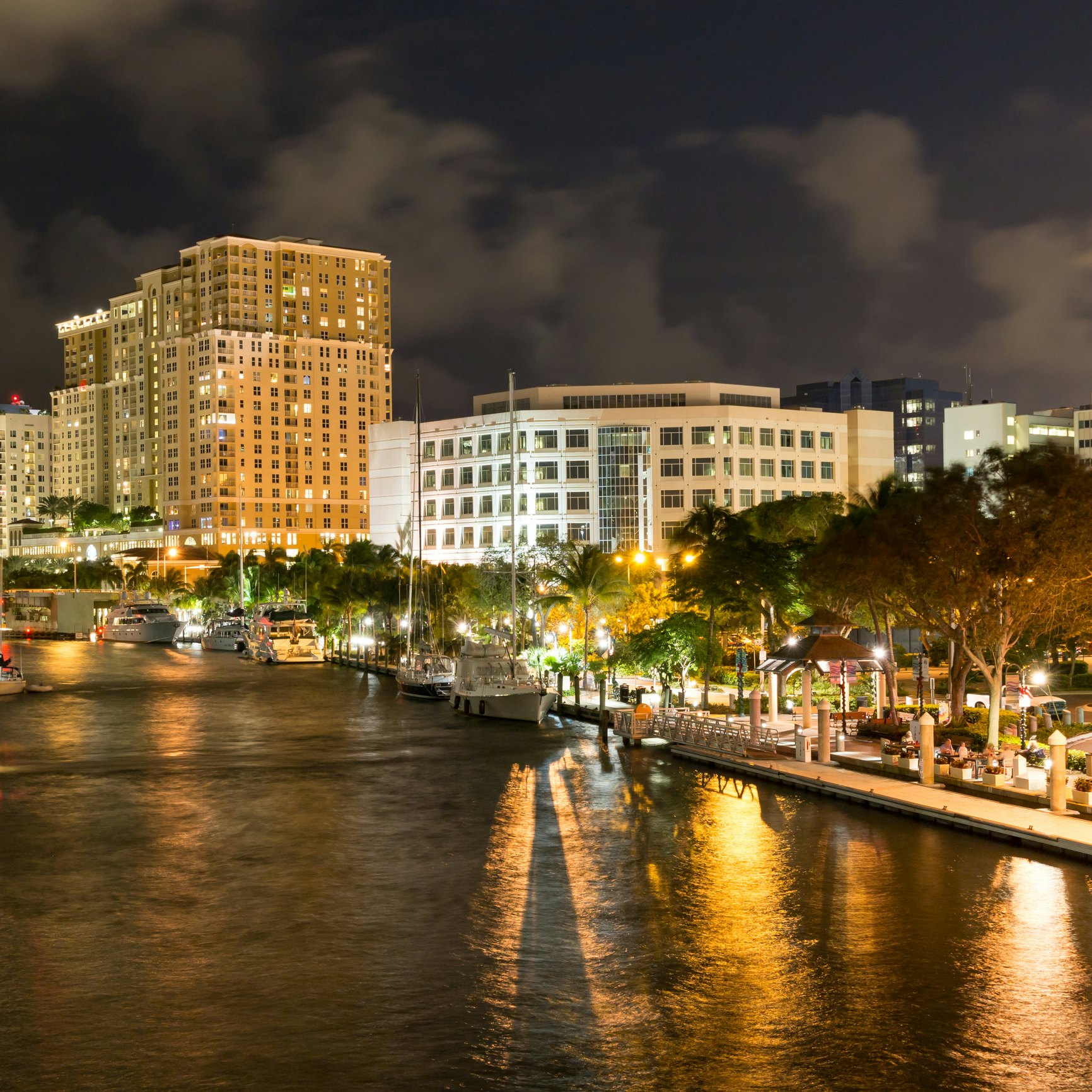 FORT LAUDERDALE, USA - DEC 6, 2015: Night view of New River with Riverwalk promenade highrise condominium buildings and yachts in Fort Lauderdale, Florida; Shutterstock ID 355336061; Your name (First / Last): Lauren Keith; GL account no.: 65050; Netsuite department name: Content Asset; Full Product or Project name including edition: Guides Project Eastern USA