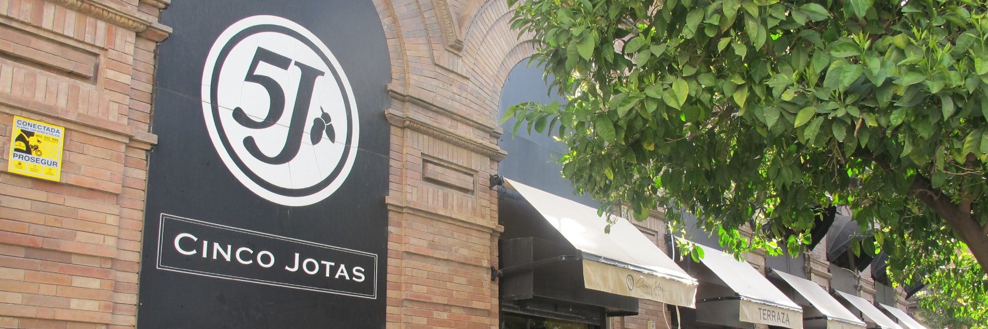 5 Jotas sign on wall and awnings