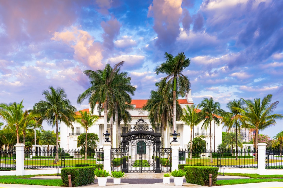 WEST PALM BEACH, FLORIDA - APRIL 4, 2016: The Flagler Museum exterior and grounds. The beaux arts mansion was constructed by Henry Flagler.; Shutterstock ID 402760483; Your name (First / Last): Lauren Keith; GL account no.: 65050; Netsuite department name: Content Asset; Full Product or Project name including edition: Guides Project Eastern USA