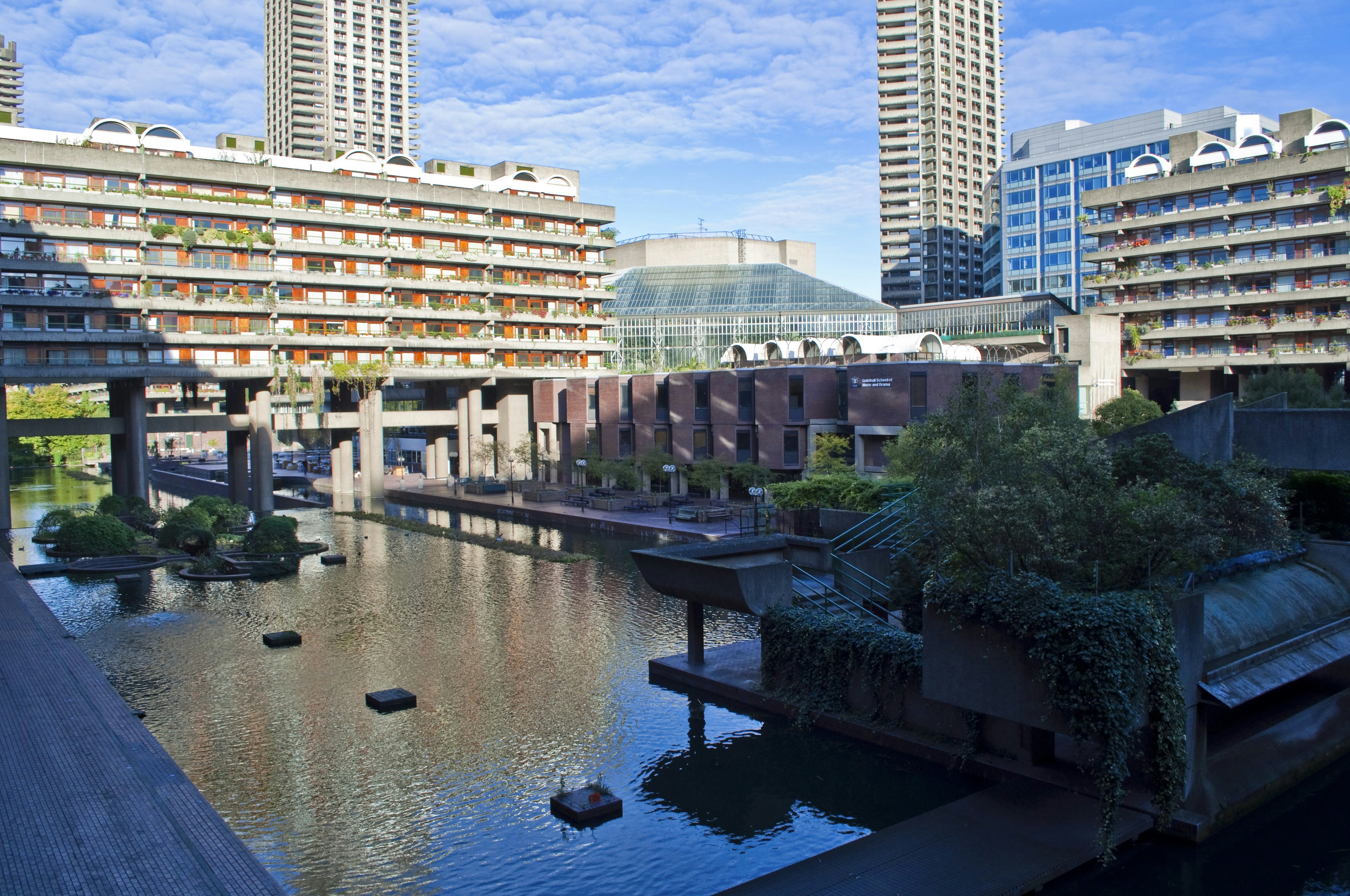 Water feature, residential towers and the Barbican Centre.