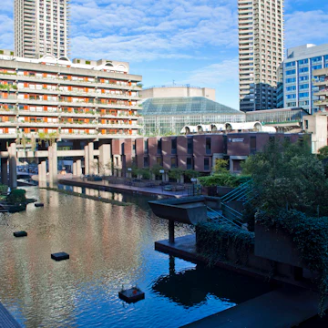 Water feature, residential towers and the Barbican Centre.