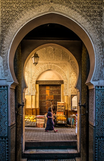 A look into the old medina in Fes, through the door of the Bou Inania Medrassa, the ancient university.