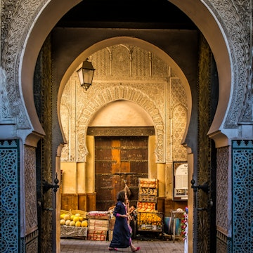 A look into the old medina in Fes, through the door of the Bou Inania Medrassa, the ancient university.