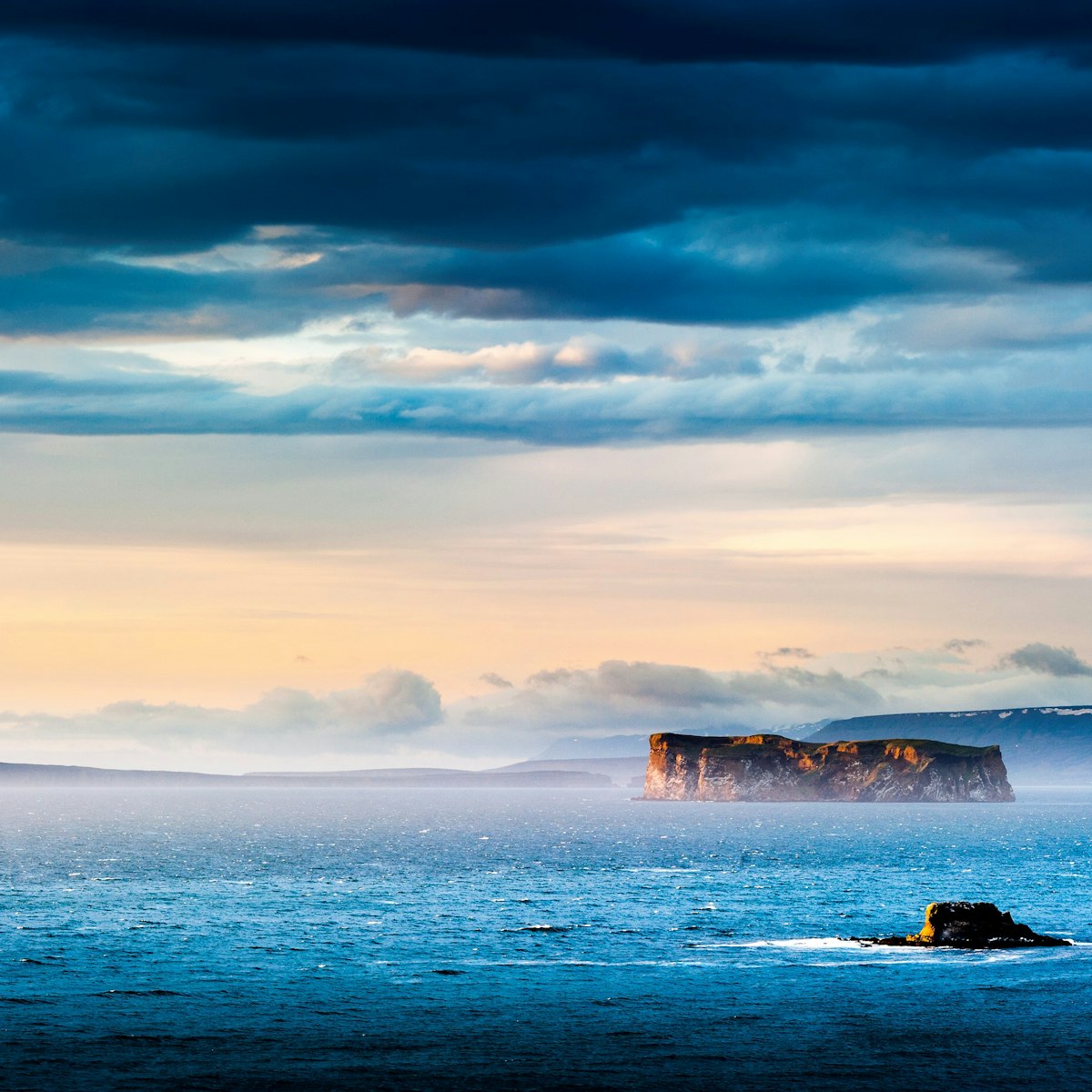 drangey island during midnight sun, northern iceland; drangey is the place of the classic Grettis saga