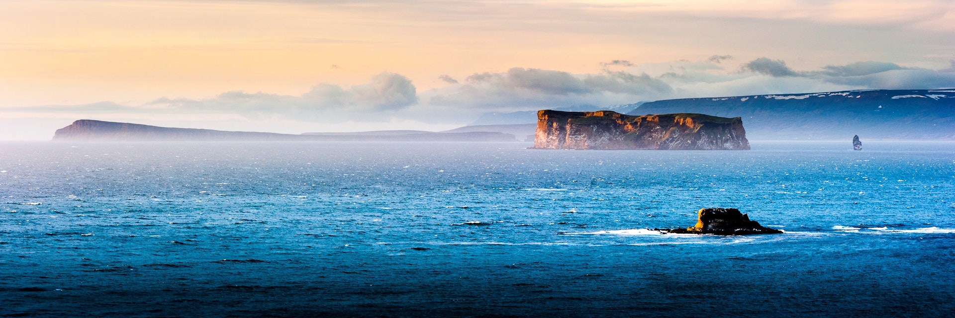 drangey island during midnight sun, northern iceland; drangey is the place of the classic Grettis saga