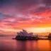 A burning dawn sky above the beautiful Sydney Opera House.