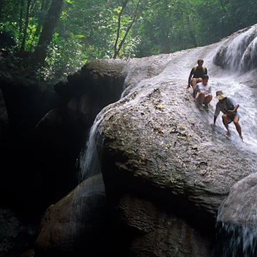 Pacific Islands, Melanesia, Solomon Islands. Backpackers trekking through the forest.