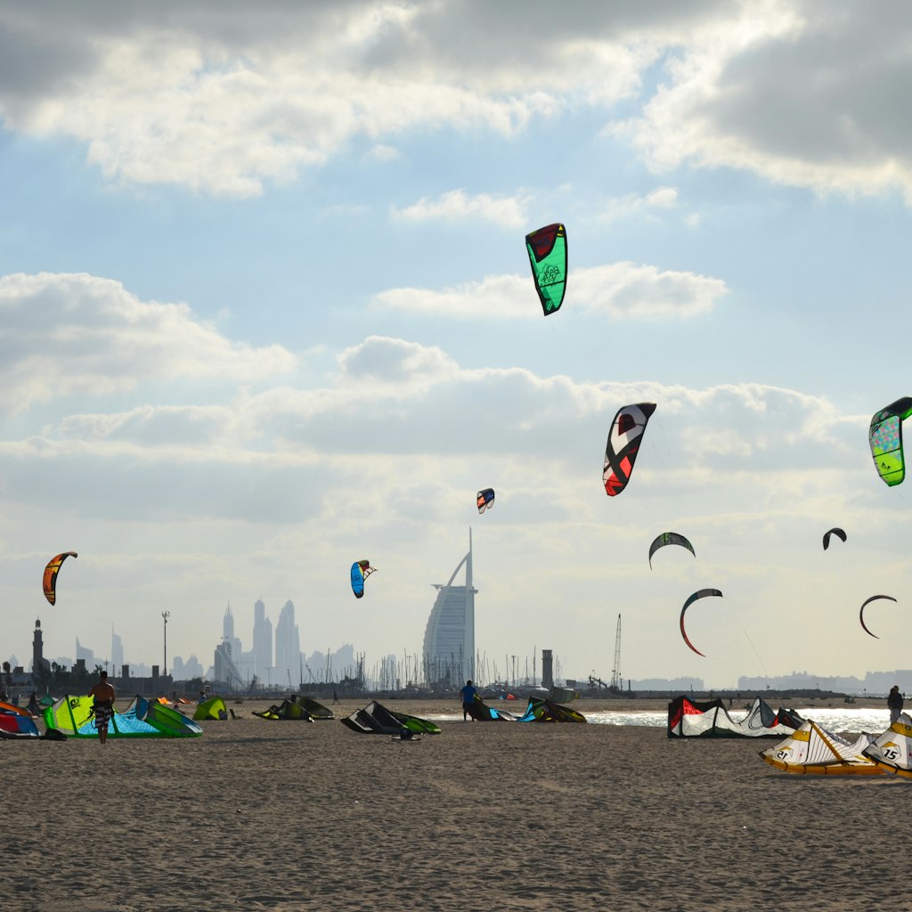11/30/2014. Kite beach in Jumeirah, Dubai, United Arab Emirates. A stretch of the beach designated for the kite surfers. The iconic Burj Al Arab is seen on the background.; Shutterstock ID 664989337; Your name (First / Last): Lauren Keith; GL account no.: 65050; Netsuite department name: Online Editorial; Full Product or Project name including edition: Authentic Dubai Article
