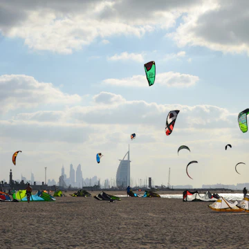 11/30/2014. Kite beach in Jumeirah, Dubai, United Arab Emirates. A stretch of the beach designated for the kite surfers. The iconic Burj Al Arab is seen on the background.; Shutterstock ID 664989337; Your name (First / Last): Lauren Keith; GL account no.: 65050; Netsuite department name: Online Editorial; Full Product or Project name including edition: Authentic Dubai Article