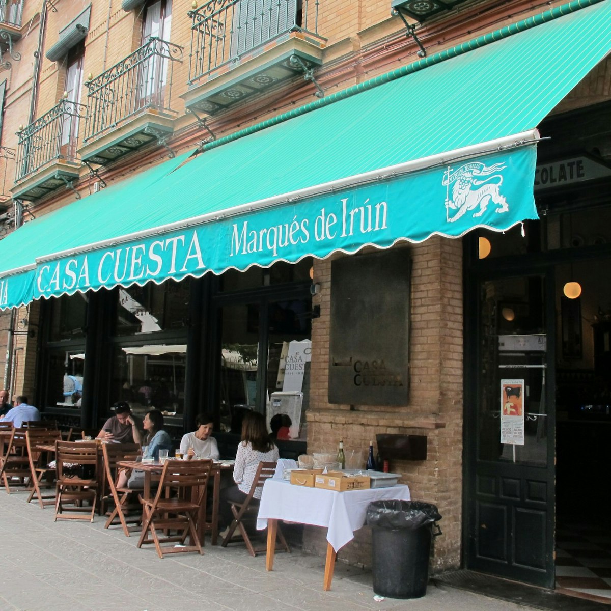 Casa Cuesta restaurant awning with tables.