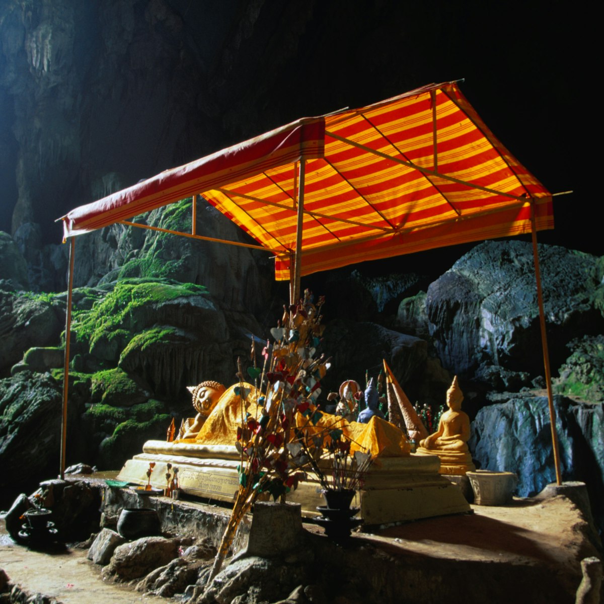 Tham Phu Kham cave, with the Thai bronze reclining Buddha in the distance, Vang Vieng