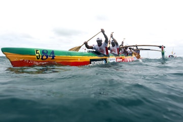 A team paddles in their Vaa, a Polynesian outrigger canoe, on the second day of the Hawaiki Nui Vaa race on November 6, 2014, following their start from the main island of Huahine. Each year, the race brings together more than 130 teams in a three stage race over three days:- the Huahine Raiatea, (44.5 km), Raiatea-Tahaa (26 km) and Tahaa, Bora Bora (58.2 km) without changing crew. The kickoff of this new edition has been given this morning Fare . AFP PHOTO/GREGORY BOISSY        (Photo credit should read GREGORY BOISSY/AFP/Getty Images)