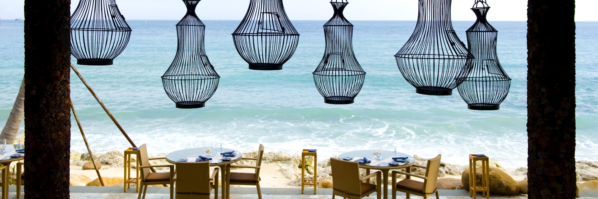 SANYA, CHINA - August 15: A beach restaurant awaits guests in the Mandarin Oriental hotel resort on the on the Dadonghai bay, coast of Sanya on August 15, 2010 in Hainan province, China. Sanya is the southernmost city of Hainan island, located in the Southern Chinese Sea. Sometimes referred to as the Hawaii of China because of its tropical climate, palm trees and white-sand beaches, Sanya is a booming tourism destination. (Photo by Lucas Schifres/Getty Images)