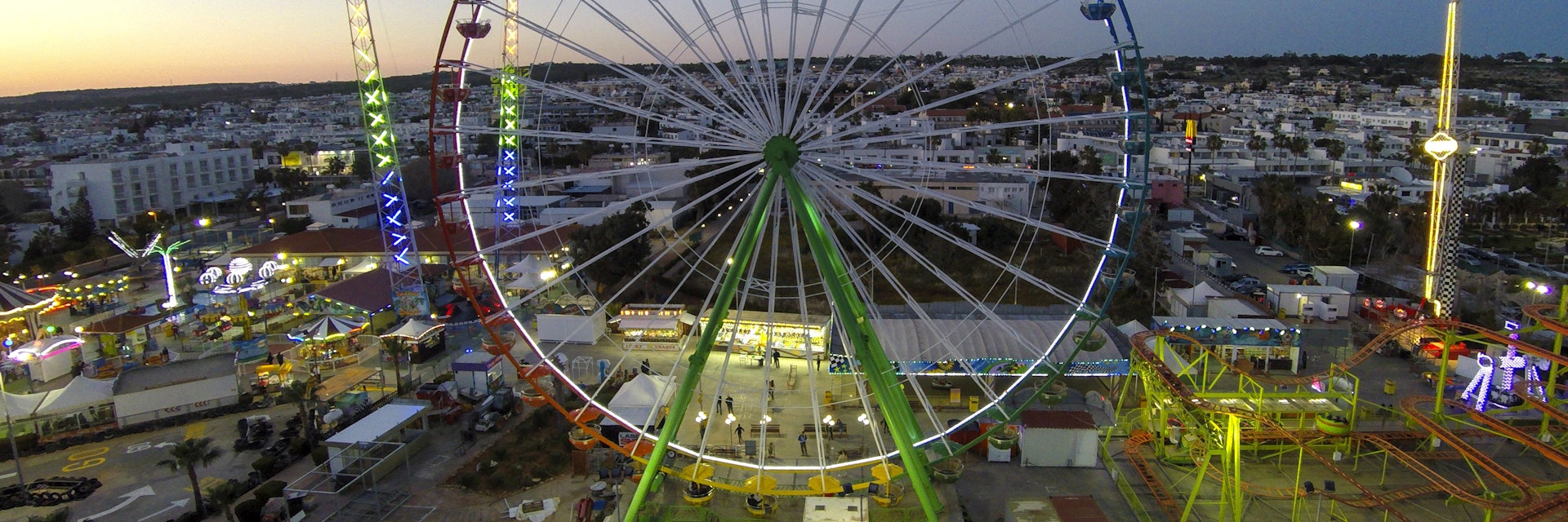 LARNACA, CYPRUS - APRIL 12: Aerial view of Parko Paliatso Luna park on April 12, 2015 in Larnaca, Cyprus.Parko Paliatso Luna park is a family owned funfair in the heart of Ayia Napa, on Nissi Avenue. It opened in 1999 and today covers an area of 25,000 square metres with more than 25 attractions. For smaller children there is a large indoor play area and plenty of rides to enjoy, such as bumper boats, tea-cups, trampolines and carousels. (Photo by Athanasios Gioumpasis/Getty Images)