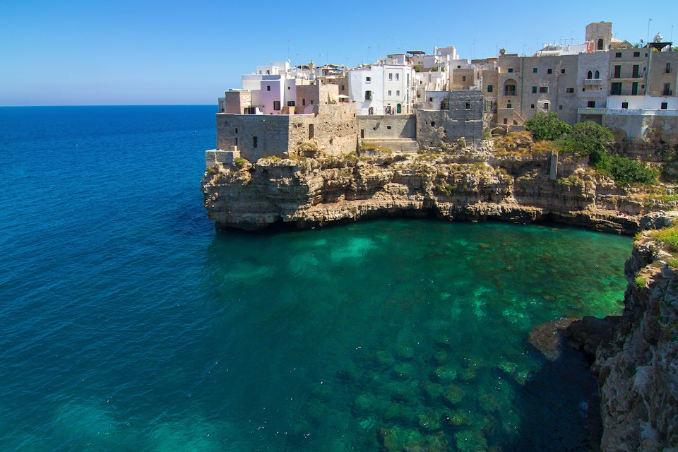 Polignano a Mare: view on green blue sea and cliffs