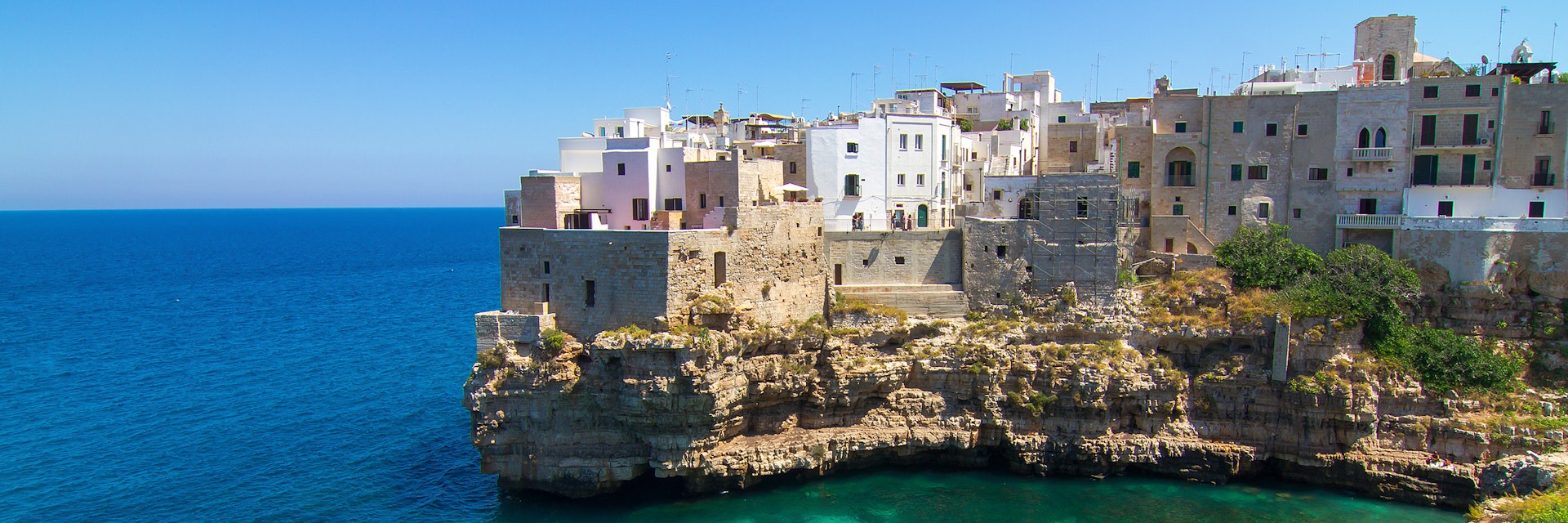 Polignano a Mare: view on green blue sea and cliffs