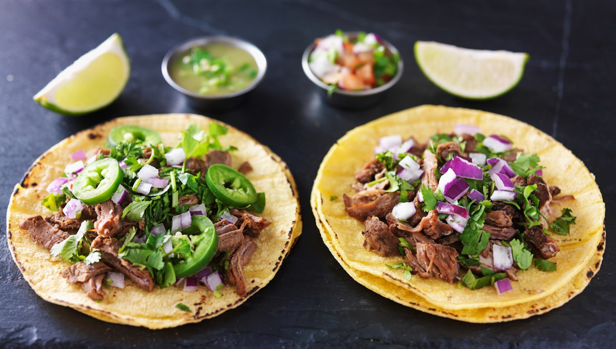 500px Photo ID: 103772725 - two authentic mexican tacos with barbacoa and carnitas on slate table top