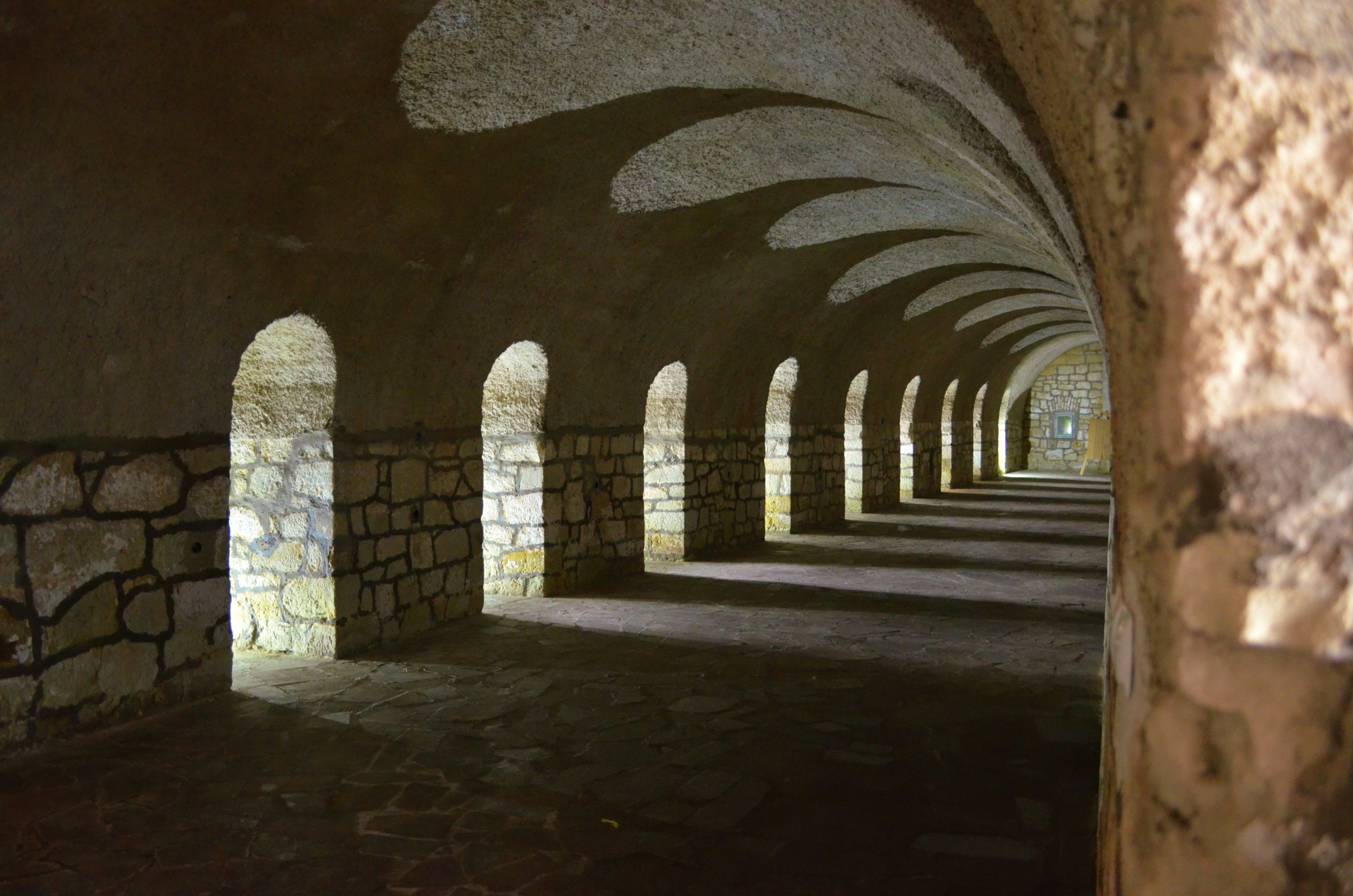 A hallway located in a fortress in K?odzko. Many windows with arches create beautiful shadows