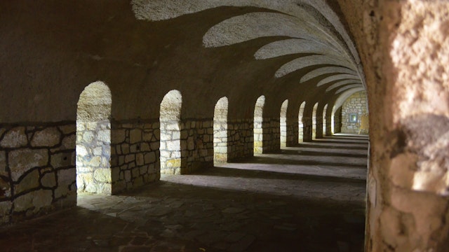 A hallway located in a fortress in K?odzko. Many windows with arches create beautiful shadows