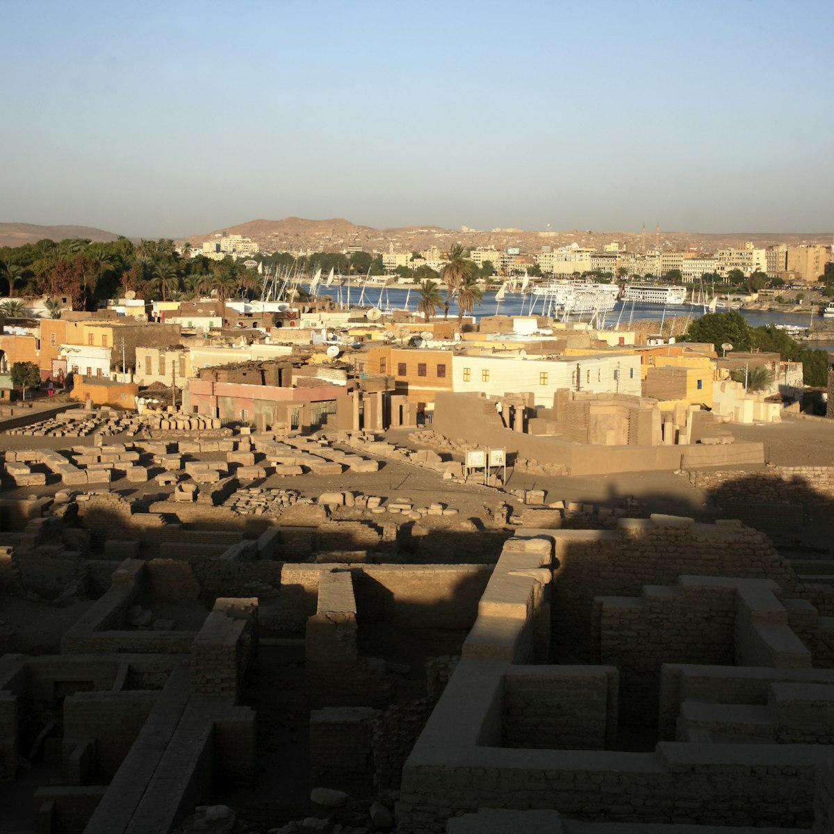 Ruins of Abu on Elephantine Island with Nile River in the background.