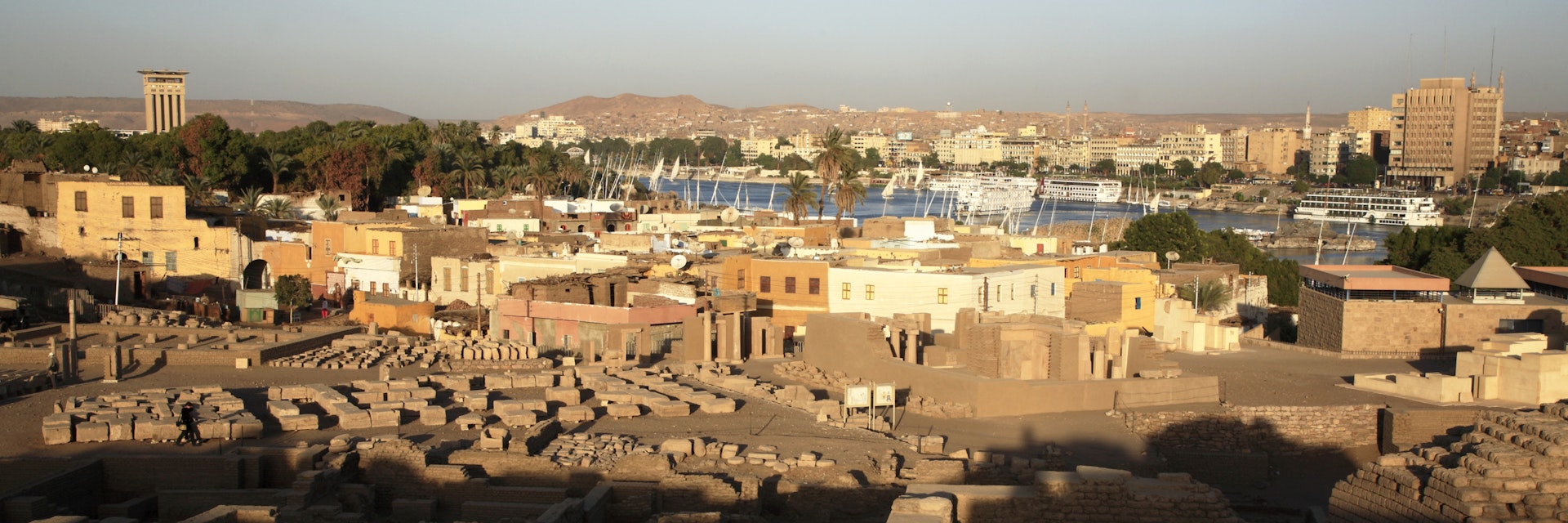 Ruins of Abu on Elephantine Island with Nile River in the background.