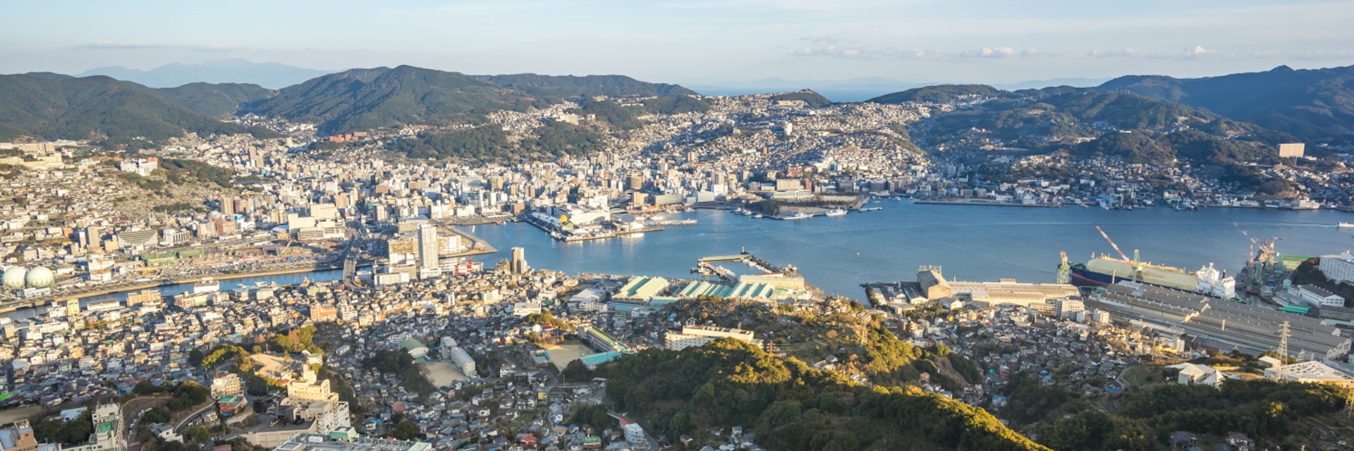 Nagasaki city skyline view from Inasa Mount in Nagasaki, Japan.; Shutterstock ID 1040318305; Your name (First / Last): Laura Crawford; GL account no.: 65050; Netsuite department name: Online Editorial; Full Product or Project name including edition: HCMC & Nagasaki page images BiA