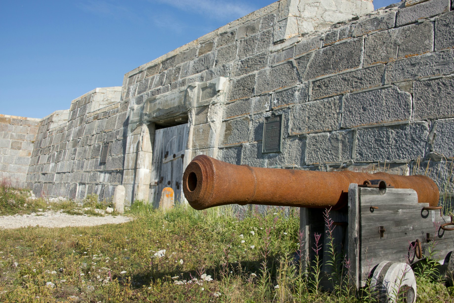 Parks Canada, National Historic Site of Canada, Prince of Wales Fort, Antique cannon in front of fort wall, Churchill, Manitoba, Canada