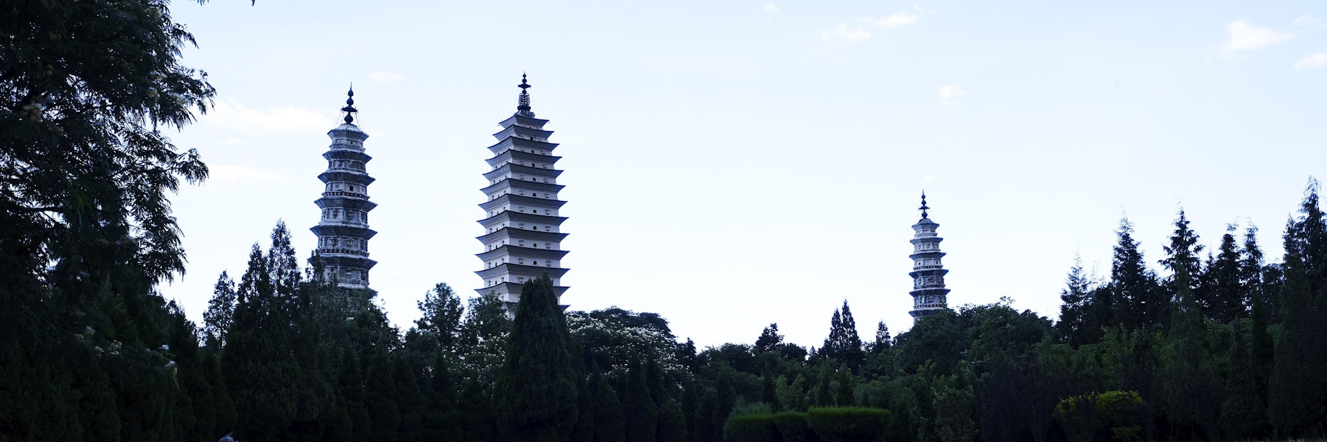 Three Pagodas visible across a pond.