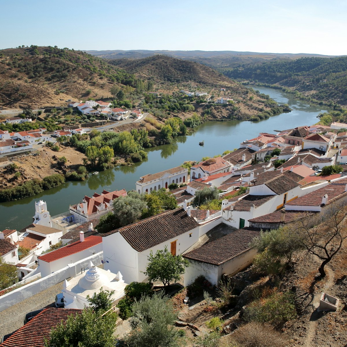 MERTOLA, PORTUGAL: General view of the fortified village and the surrounding hills from the castle; Shutterstock ID 511409617; Your name (First / Last): Tom Stainer; GL account no.: 65050 ; Netsuite department name: Online Editorial ; Full Product or Project name including edition: Best in Europe 2017