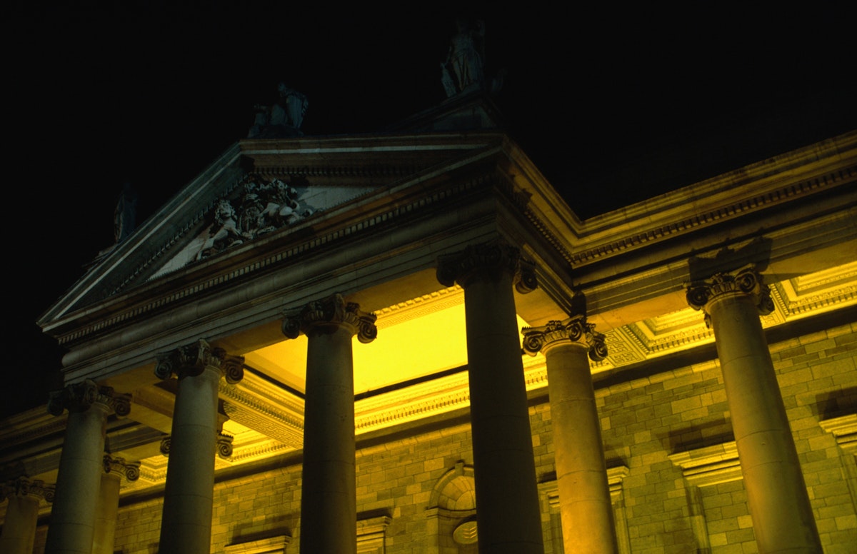 Bank of Ireland 19th century building on College Green at night.