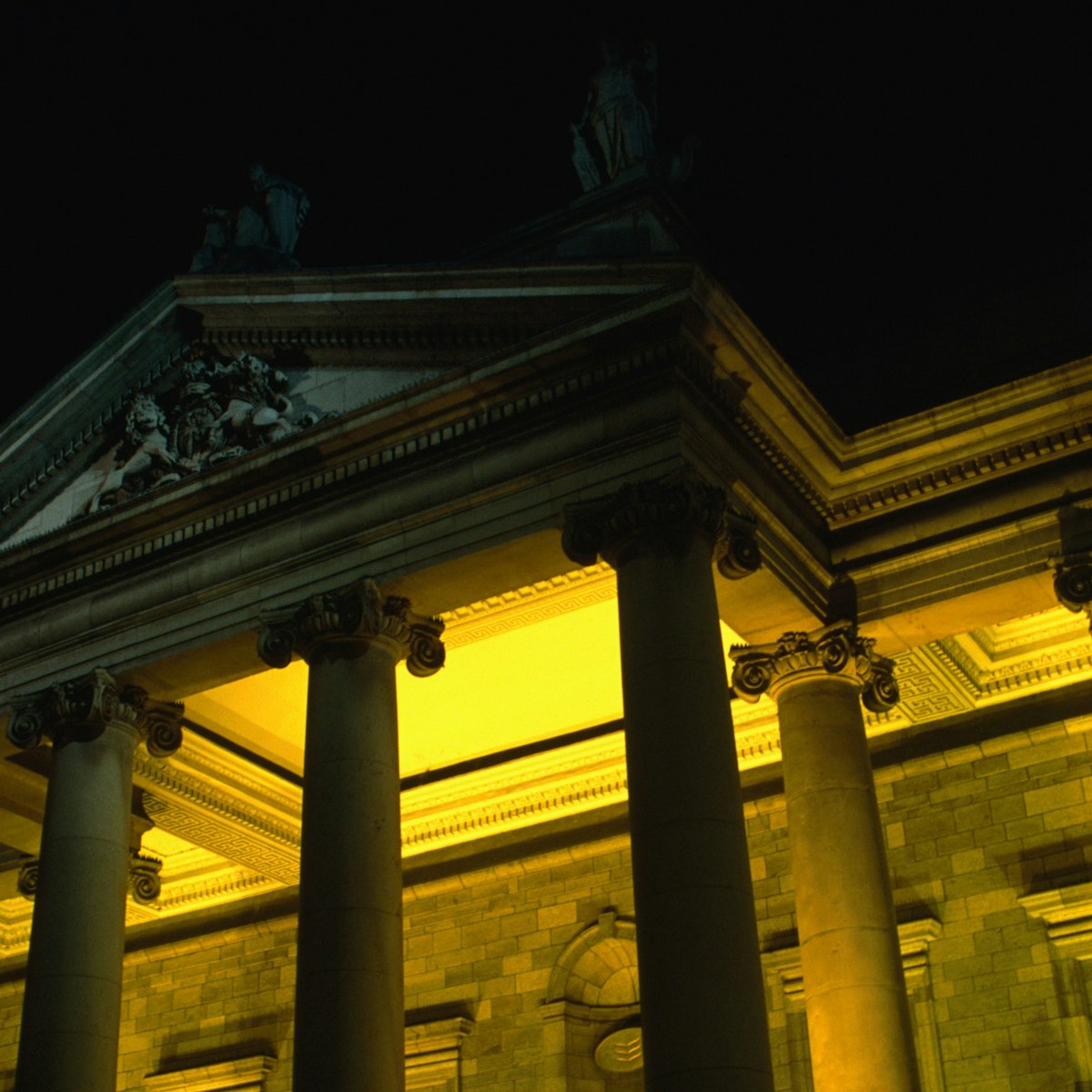 Bank of Ireland 19th century building on College Green at night.